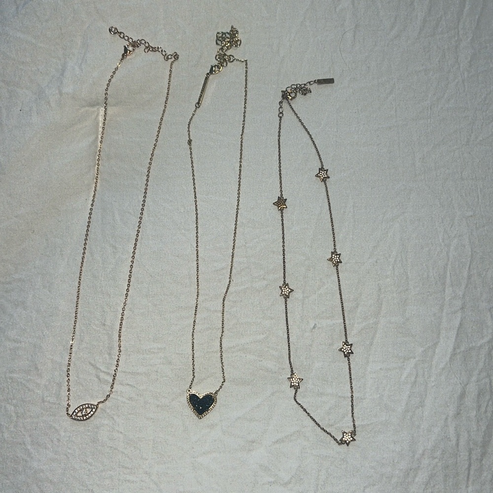 Three necklaces 
Kendra Scott in middle